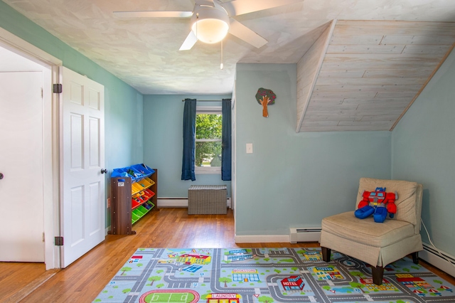 1 Madison St, Augusta, ME 04330 - game room with baseboard heating, a baseboard radiator, wood finished floors, and ceiling fan