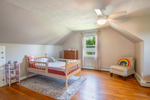 1 Madison St, Augusta, ME 04330 - bedroom featuring wood finished floors, baseboard heating, lofted ceiling, a ceiling fan, and a textured ceiling
