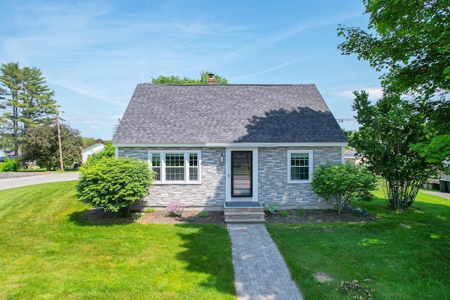 1 Madison St, Augusta, ME 04330 - cape cod house featuring a front lawn, stone siding, and a chimney