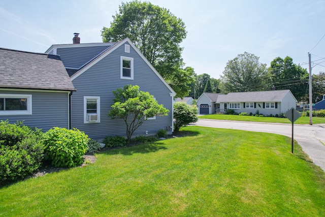 1 Madison St, Augusta, ME 04330 - view of side of property with a chimney, a yard, roof with shingles, and cooling unit