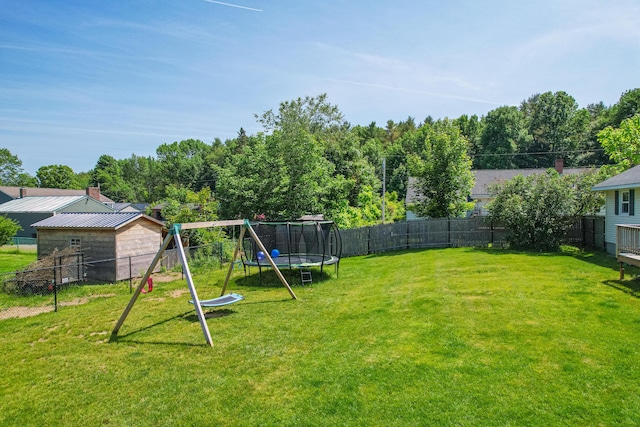 1 Madison St, Augusta, ME 04330 - fenced backyard featuring a trampoline and a playground