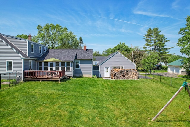 1 Madison St, Augusta, ME 04330 - rear view of property with a wooden deck, a garage, a chimney, and a shingled roof