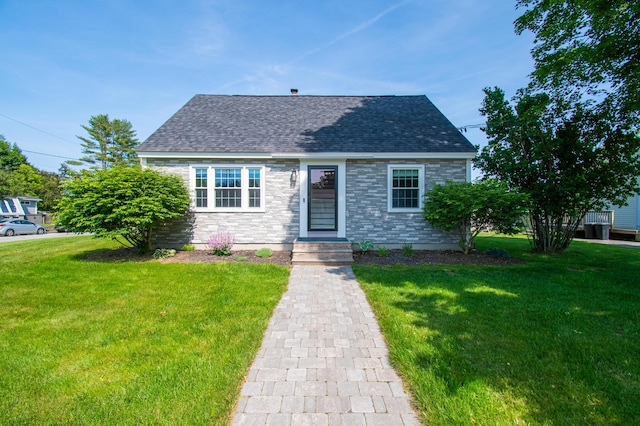 1 Madison St, Augusta, ME 04330 - view of front of house featuring a front lawn and roof with shingles