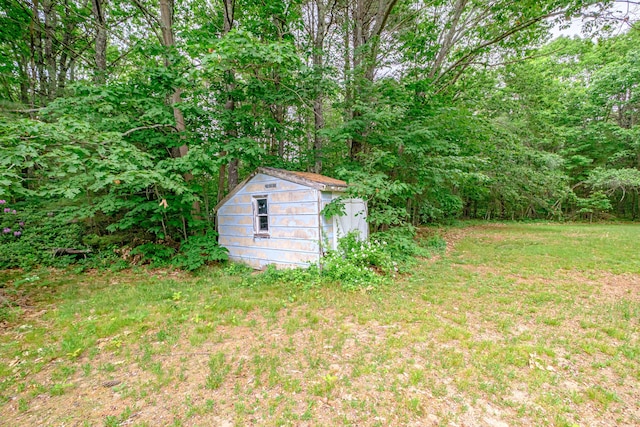 375 Gorham Rd, Scarborough, ME 04074 - view of yard featuring a storage unit and a view of trees