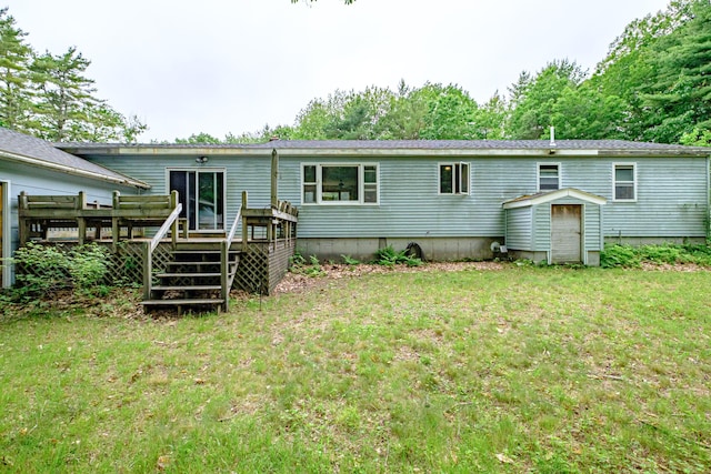 375 Gorham Rd, Scarborough, ME 04074 - rear view of house with a deck, a lawn, and a storage shed