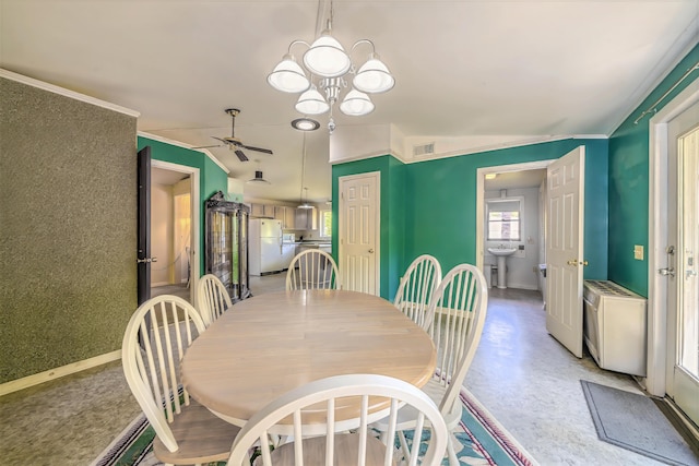 31 Herrick Rd, Belfast, ME 04915 - dining area featuring a ceiling fan, a chandelier, and crown molding