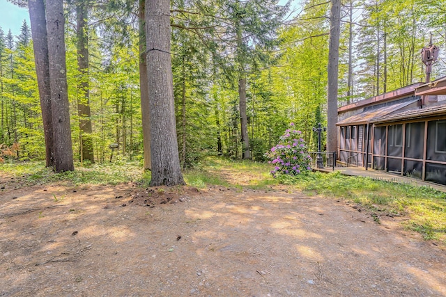31 Herrick Rd, Belfast, ME 04915 - view of yard with a sunroom and a wooded view