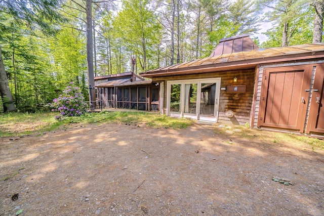 31 Herrick Rd, Belfast, ME 04915 - back of property with a sunroom and a standing seam roof