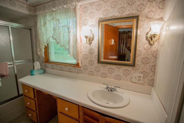 142 Military Rd, Greenbush, ME 04418 - bathroom featuring wallpapered walls, vanity, and combined bath / shower with glass door