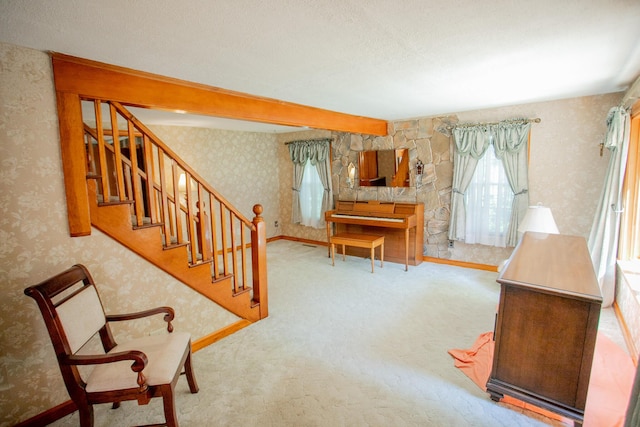 142 Military Rd, Greenbush, ME 04418 - living room with wallpapered walls, stairway, and carpet flooring