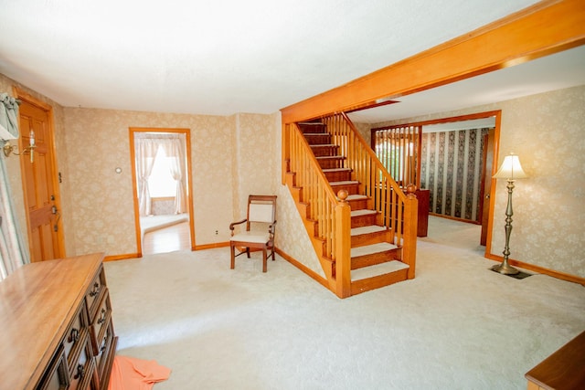 142 Military Rd, Greenbush, ME 04418 - stairs with wallpapered walls and carpet floors