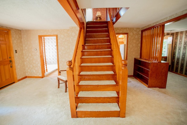 142 Military Rd, Greenbush, ME 04418 - stairway featuring wallpapered walls and carpet flooring