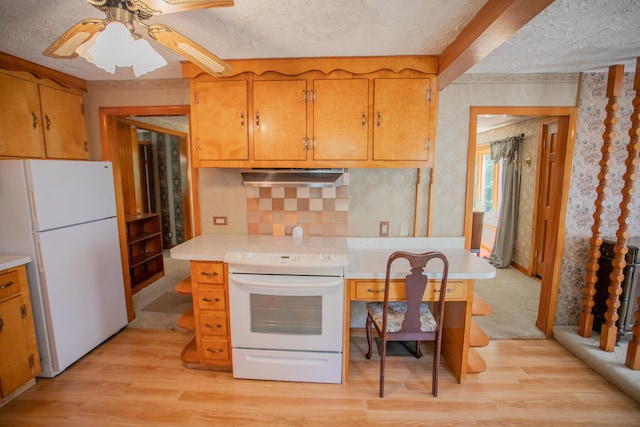 142 Military Rd, Greenbush, ME 04418 - kitchen with white appliances, ventilation hood, wallpapered walls, light wood finished floors, and light countertops