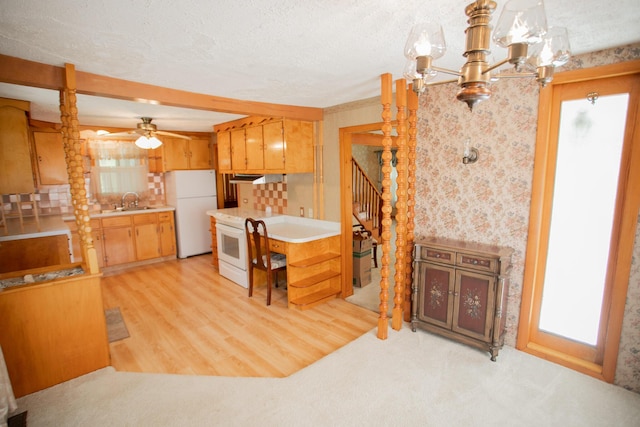142 Military Rd, Greenbush, ME 04418 - kitchen with white appliances, light countertops, wallpapered walls, a ceiling fan, and a textured ceiling