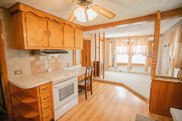 142 Military Rd, Greenbush, ME 04418 - kitchen with exhaust hood, white electric range oven, light wood finished floors, ceiling fan, and a chandelier