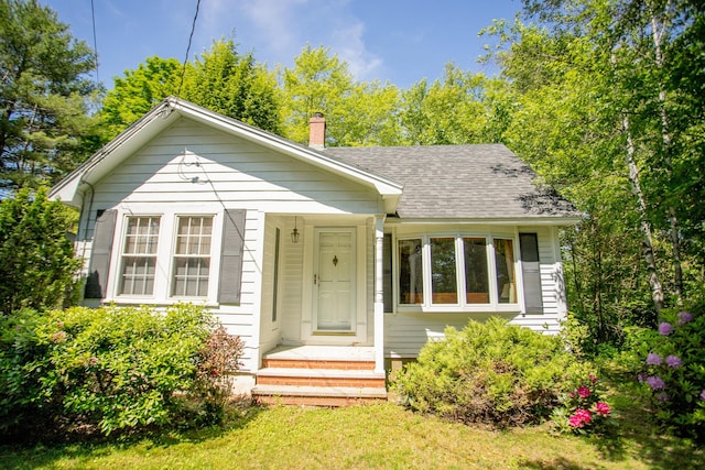 142 Military Rd, Greenbush, ME 04418 - bungalow-style home with a chimney and roof with shingles