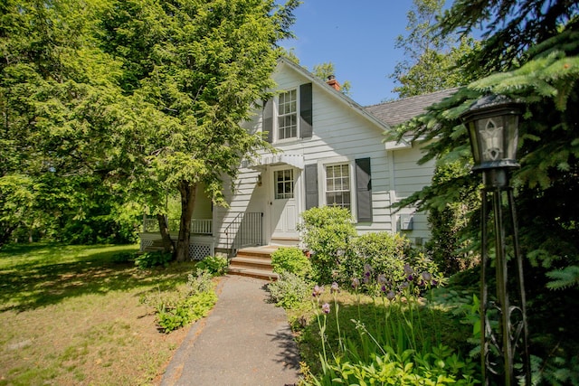 142 Military Rd, Greenbush, ME 04418 - view of front of home with a chimney and a front yard