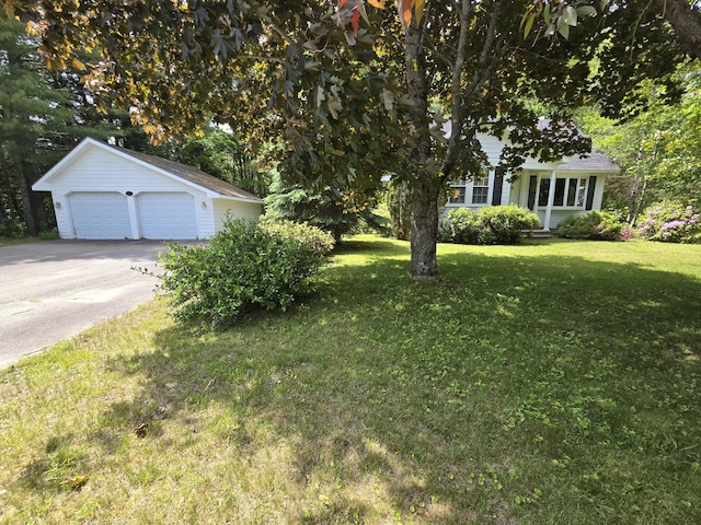142 Military Rd, Greenbush, ME 04418 - view of green lawn with a garage and an outbuilding
