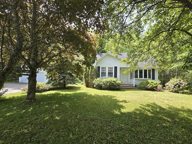 142 Military Rd, Greenbush, ME 04418 - view of front of property with a front lawn and roof with shingles