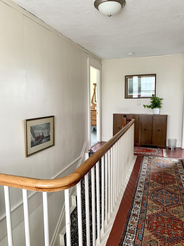 361 Water St, Addison, ME 04606 - corridor with a textured ceiling, wood finished floors, and an upstairs landing
