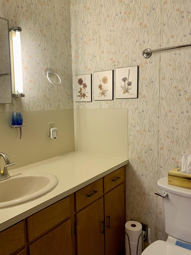 361 Water St, Addison, ME 04606 - bathroom with wallpapered walls and vanity