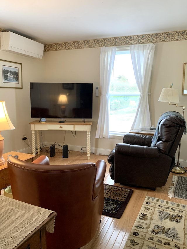 361 Water St, Addison, ME 04606 - living area with a wall mounted AC and wood finished floors