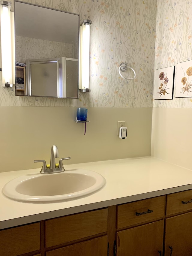 361 Water St, Addison, ME 04606 - full bathroom with wallpapered walls, vanity, and an enclosed shower