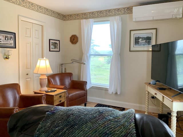 361 Water St, Addison, ME 04606 - bedroom featuring an AC wall unit and multiple windows