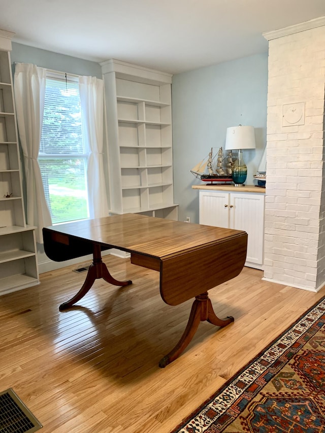 361 Water St, Addison, ME 04606 - dining area with light wood-style flooring and built in shelves