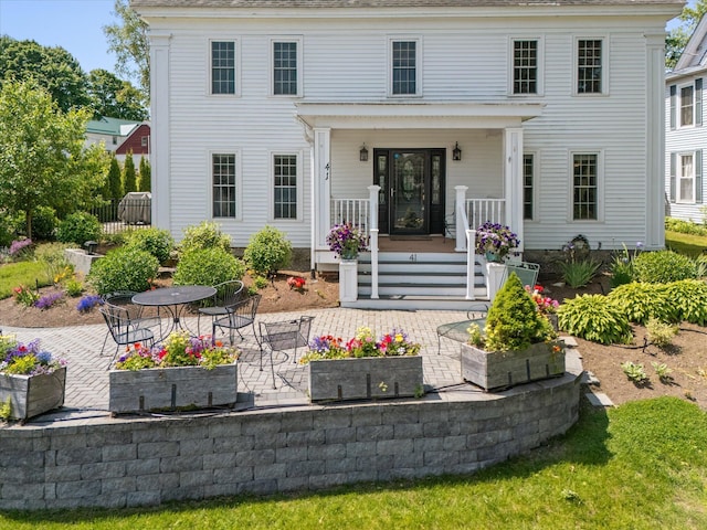 41 Main St, Old Town, ME 04468 - rear view of property with covered porch and a patio