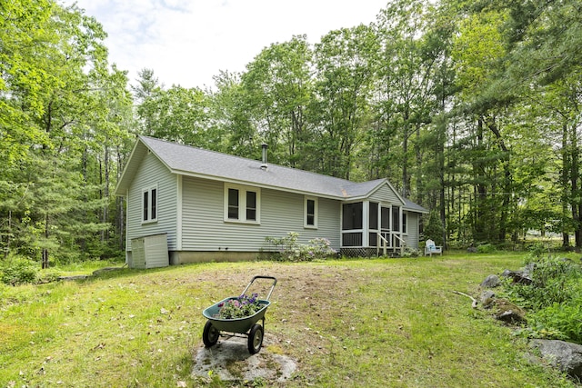 17 Eagle Ln, Damariscotta, ME 04543 - rear view of house featuring a sunroom, a yard, and roof with shingles