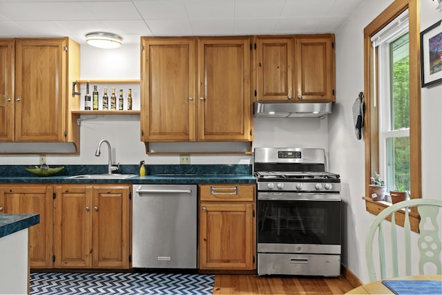 17 Eagle Ln, Damariscotta, ME 04543 - kitchen featuring stainless steel appliances, dark countertops, wood finished floors, ventilation hood, and open shelves