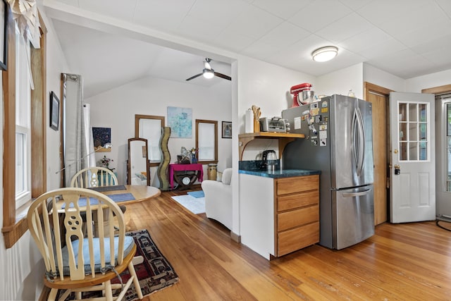17 Eagle Ln, Damariscotta, ME 04543 - kitchen with freestanding refrigerator, light wood-style flooring, dark countertops, brown cabinets, and ceiling fan