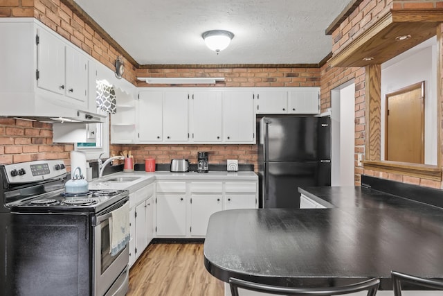 8 Grovemount Ln, Lewiston, ME 04240 - kitchen featuring stainless steel electric range, freestanding refrigerator, light wood finished floors, white cabinetry, and a textured ceiling