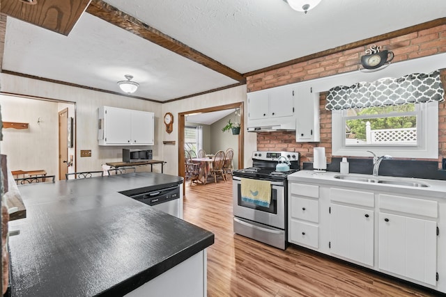8 Grovemount Ln, Lewiston, ME 04240 - kitchen featuring stainless steel appliances, light wood finished floors, white cabinets, beamed ceiling, and under cabinet range hood