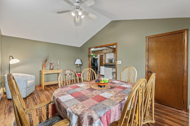 8 Grovemount Ln, Lewiston, ME 04240 - dining area with vaulted ceiling, wood finished floors, and ceiling fan
