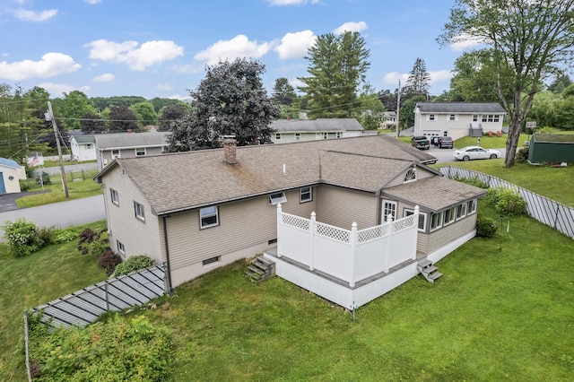 8 Grovemount Ln, Lewiston, ME 04240 - rear view of property with roof with shingles, a chimney, and a wooden deck