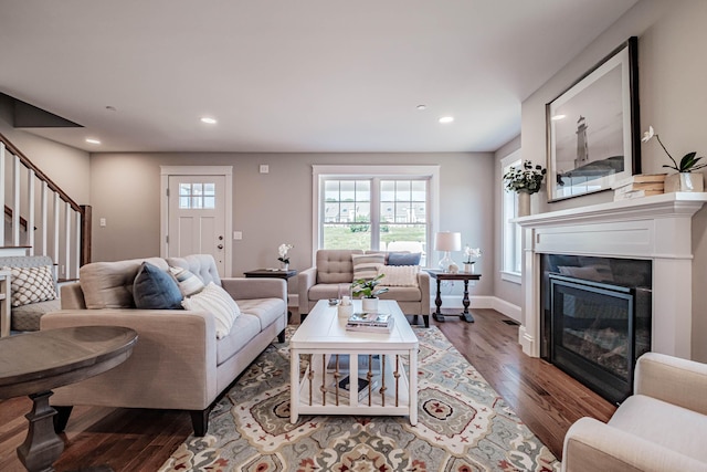 188 Falcon Crest Dr Unit 58, Gorham, ME 04038 - living room featuring wood finished floors, stairs, recessed lighting, and a glass covered fireplace