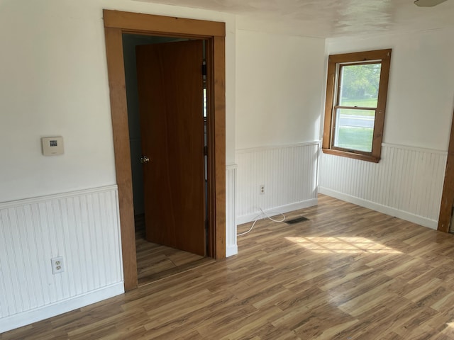 1431 Indian River Rd, Addison, ME 04606 - spare room with wainscoting and wood finished floors