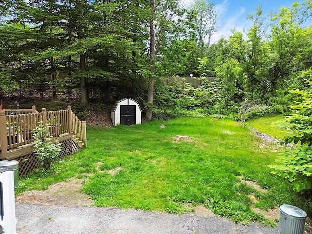 154 Rideout Ave, Lewiston, ME 04240 - view of grassy yard with a shed and a deck