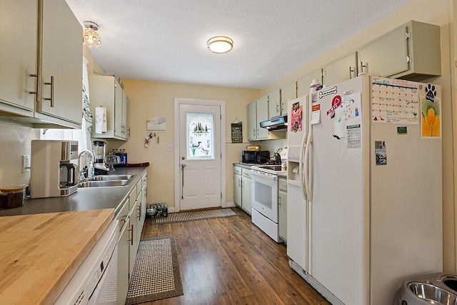 154 Rideout Ave, Lewiston, ME 04240 - kitchen featuring white appliances, under cabinet range hood, and dark wood finished floors