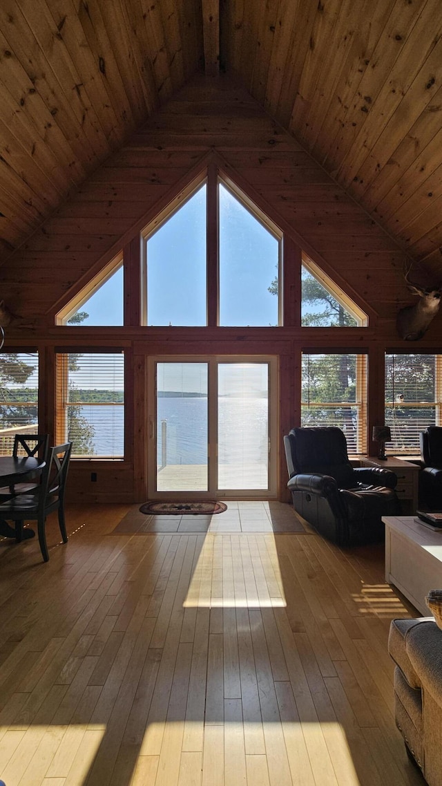 67 Upper Narrows Rd, Long Pond Twp, ME 04945 - living area featuring a wood ceiling with exposed beams, plenty of natural light, hardwood / wood-style flooring, and high vaulted ceiling