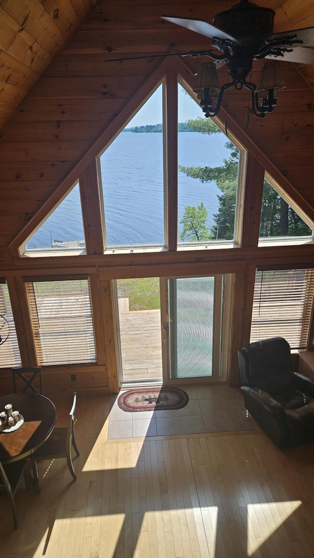 67 Upper Narrows Rd, Long Pond Twp, ME 04945 - living room featuring a water view, hardwood / wood-style flooring, high vaulted ceiling, and wood ceiling