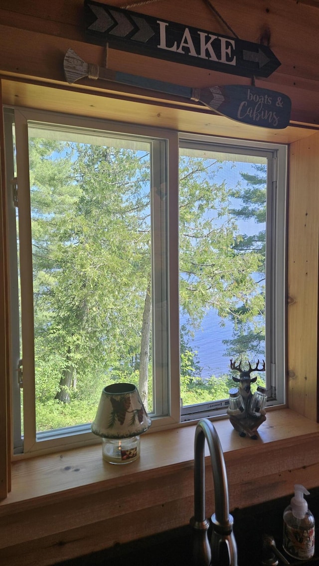 67 Upper Narrows Rd, Long Pond Twp, ME 04945 - kitchen view of wood walls