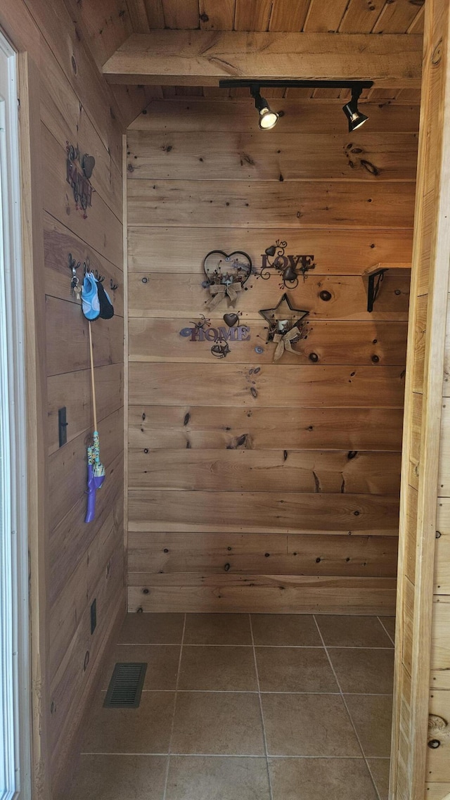 67 Upper Narrows Rd, Long Pond Twp, ME 04945 - bathroom with tile patterned floors, wood walls, and wood ceiling