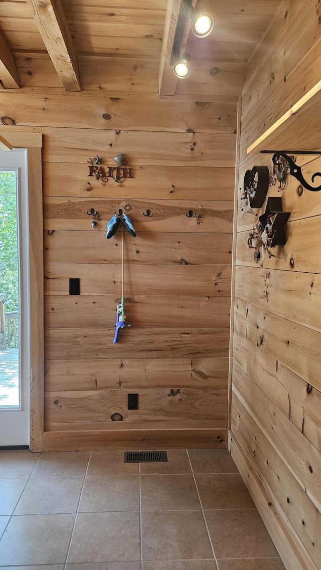 67 Upper Narrows Rd, Long Pond Twp, ME 04945 - doorway to outside featuring tile patterned flooring, wood walls, and a wooden ceiling with exposed beams