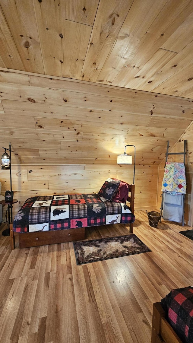 67 Upper Narrows Rd, Long Pond Twp, ME 04945 - bedroom featuring wooden ceiling, wood finished floors, and wood walls