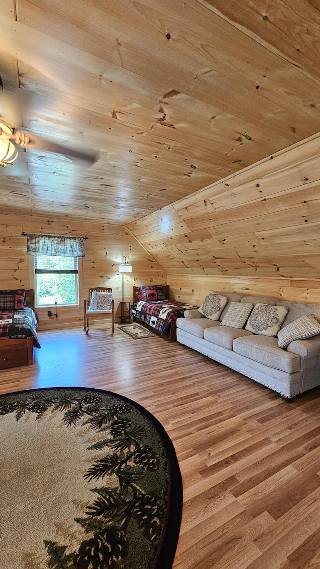 67 Upper Narrows Rd, Long Pond Twp, ME 04945 - bedroom featuring wood finished floors, wooden ceiling, and wood walls