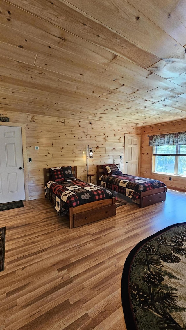 67 Upper Narrows Rd, Long Pond Twp, ME 04945 - bedroom featuring wood finished floors, wood walls, and wood ceiling