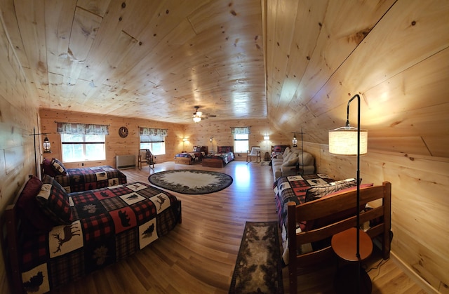 67 Upper Narrows Rd, Long Pond Twp, ME 04945 - living area featuring wood finished floors, wooden walls, and wood ceiling